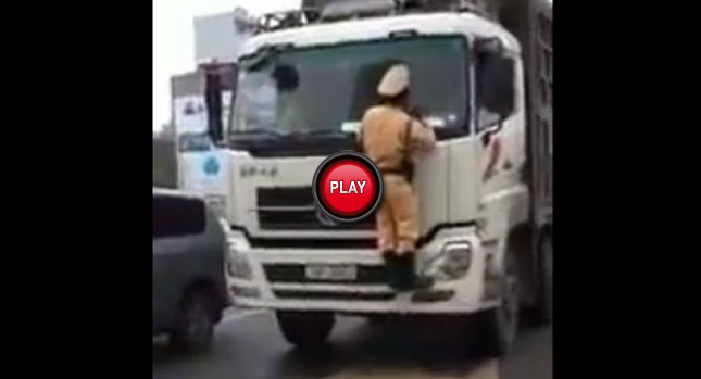  Another Vietnamese Cop Taken for a Wild Ride on a Fleeing Truck