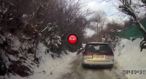  Subaru Legacy Station Wagon Loses Battle with Icy Road but Avoids the Worst