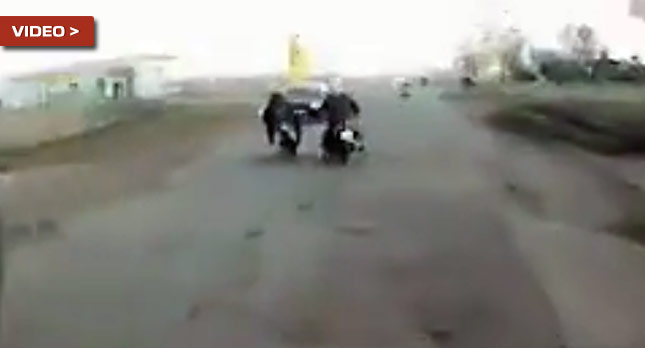  Did This Guy Push His Biker Pal Onto a Car or Was it the Potholes?