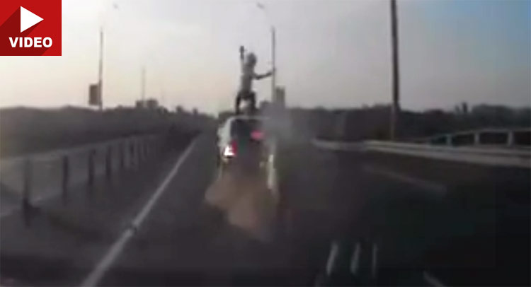  World’s Luckiest Biker Flips Over and Lands on his Feet on Moving Car’s Roof!