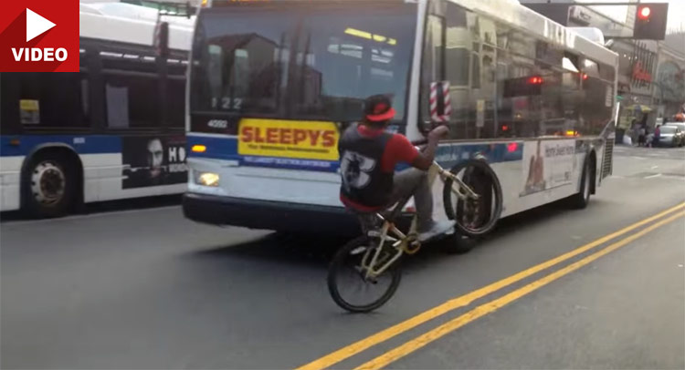  Watch These Guys Do Bicycle Wheelies Playing Chicken with Oncoming Traffic