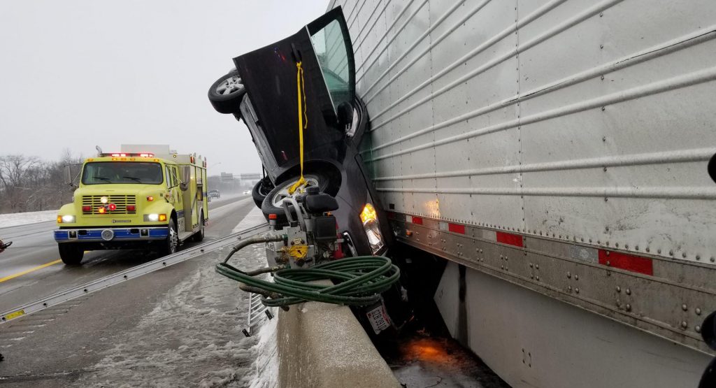  The Driver Of This Chevy Miraculously Made It Out Alive After Being Crushed By Truck