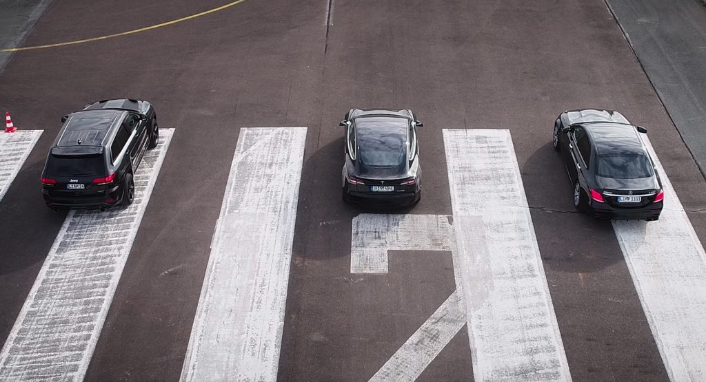  Model 3 Vs. E63 S AMG Vs. Grand Cherokee SRT8 In An Unlikely Three-Way Battle