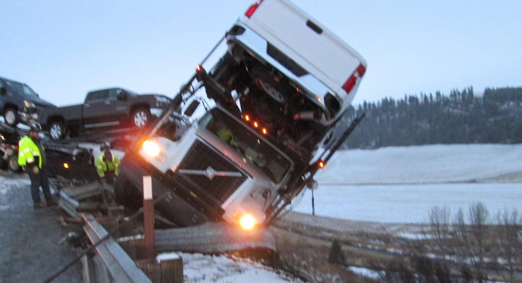  Truck Carrying Six Chevrolets Almost Slides Off Washington Cliff