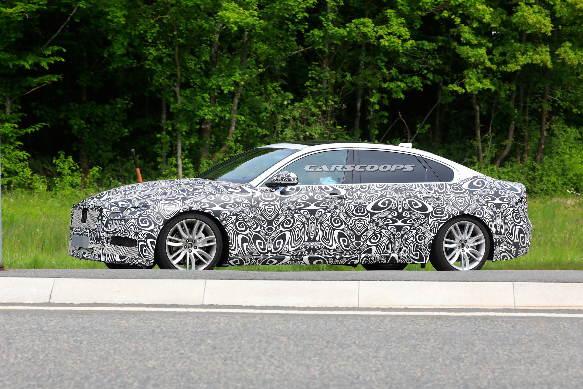 2021 jaguar xf l makes spy debut with extra space for rear