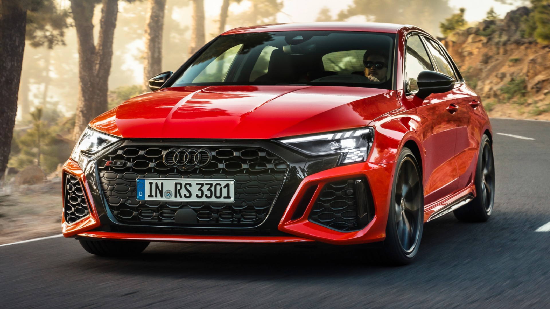 https://www.carscoops.com/wp-content/uploads/2021/07/2022-Audi-RS3-Sportback-front-dynamic.jpg