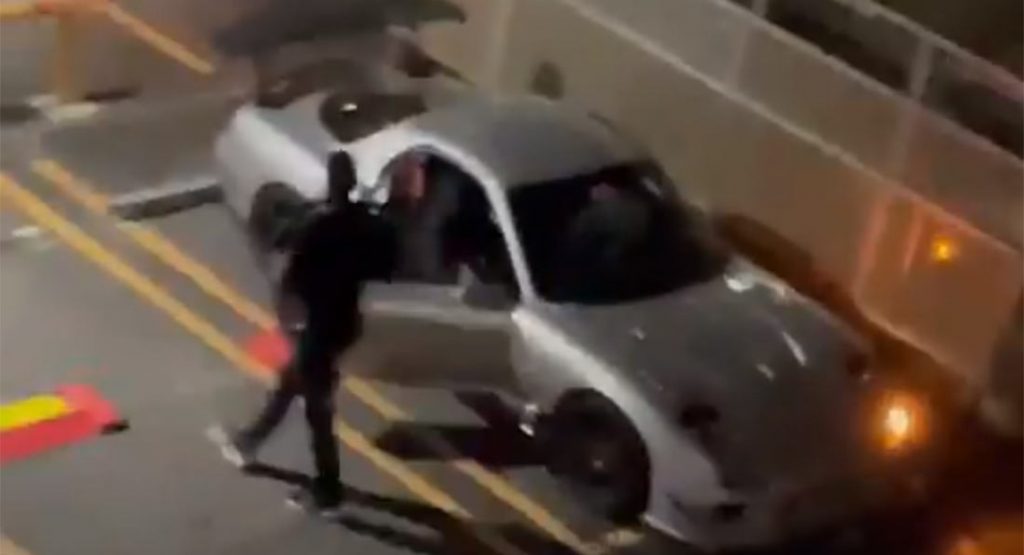  Japanese Man Screams At Thieves Stealing His Prized Mazda RX-7 As He Watches From The Balcony