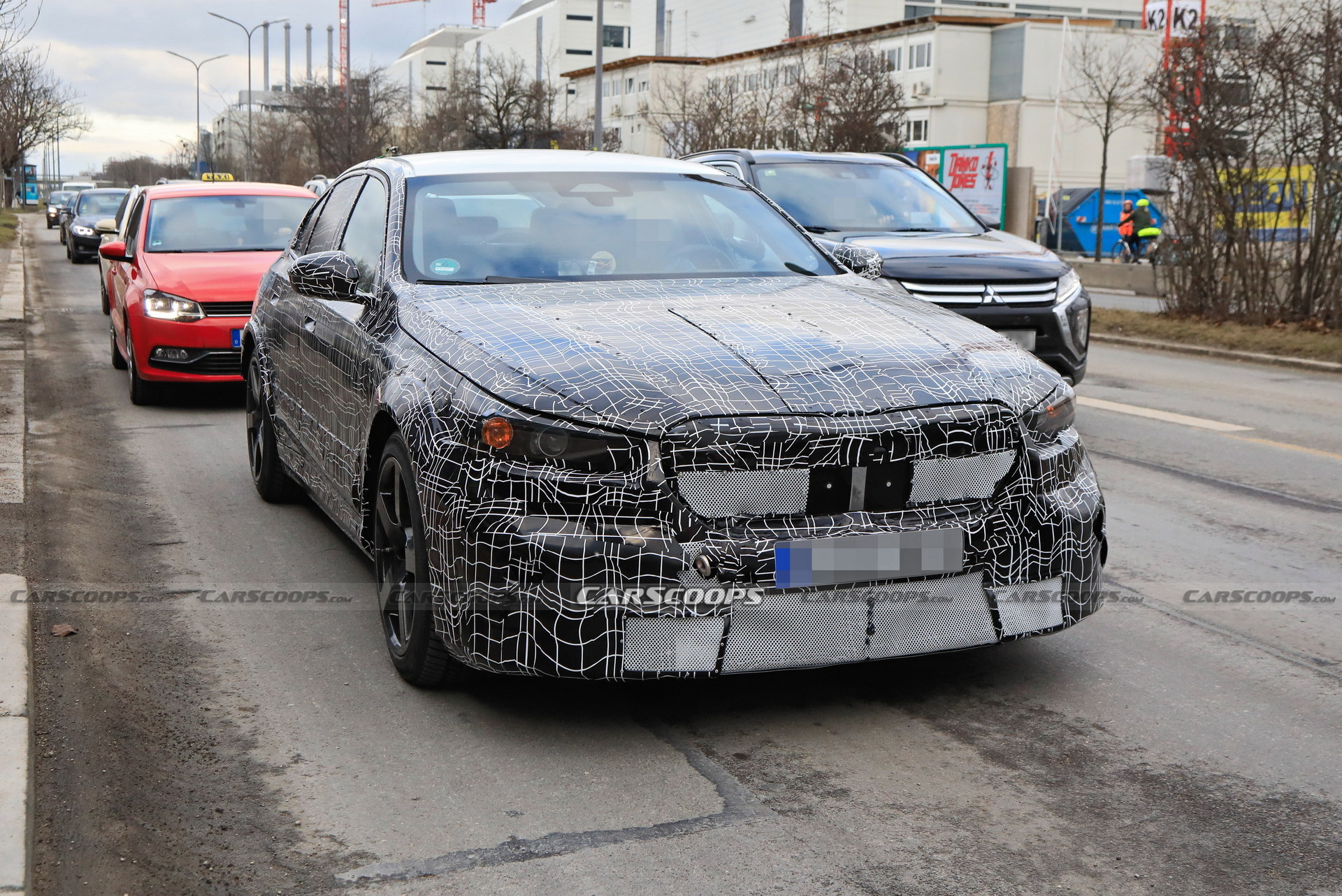 2025 BMW M5 Hybrid Makes Spy Debut Showing Its Aggressive Bodykit ...