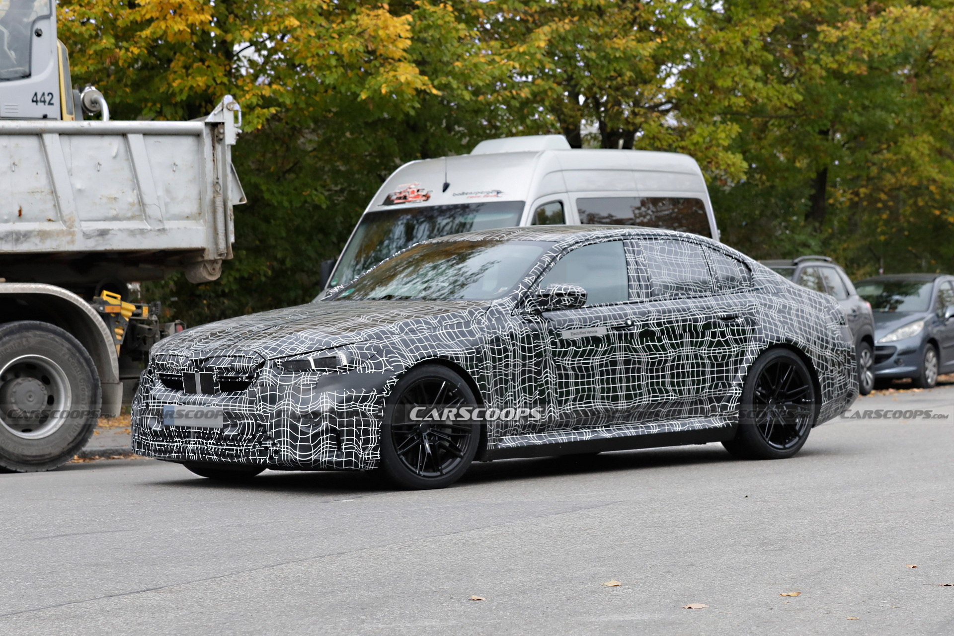 Hybrid 2024 BMW M5 Shows Production Body And Lighting, Looks