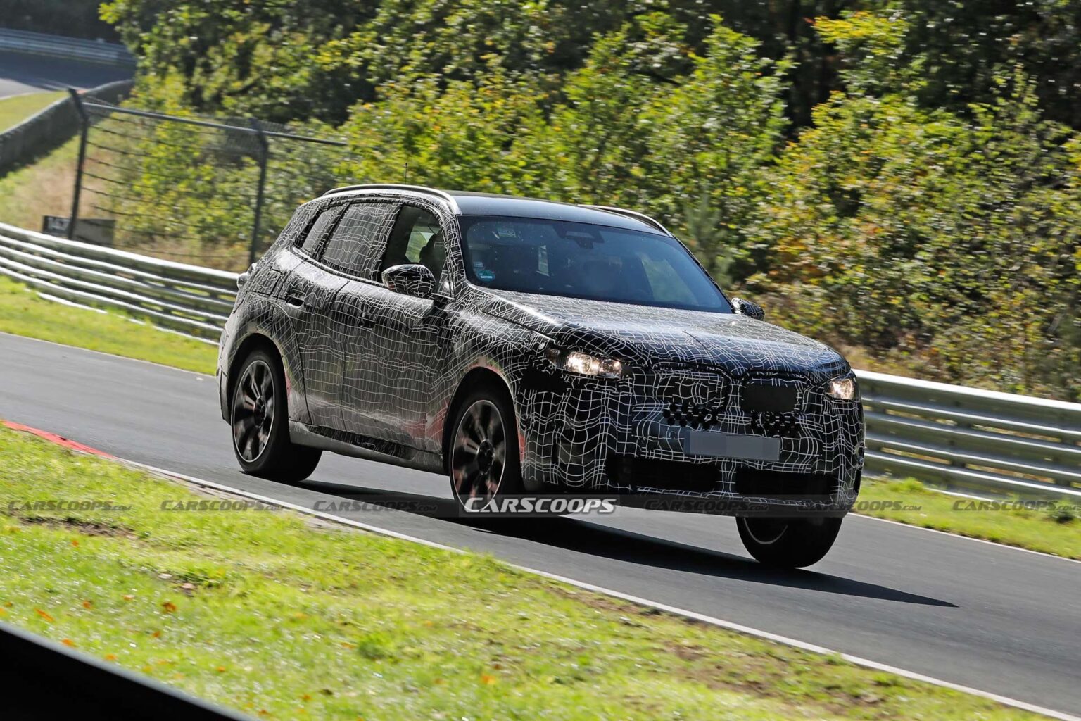 2024 BMW X3M Can’t Hide Its Big Grille Behind Disguise Carscoops