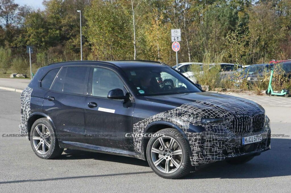 Facelifted 2024 BMW X5 Hybrid Must Be Feeling The Cold, Puts Disguise ...