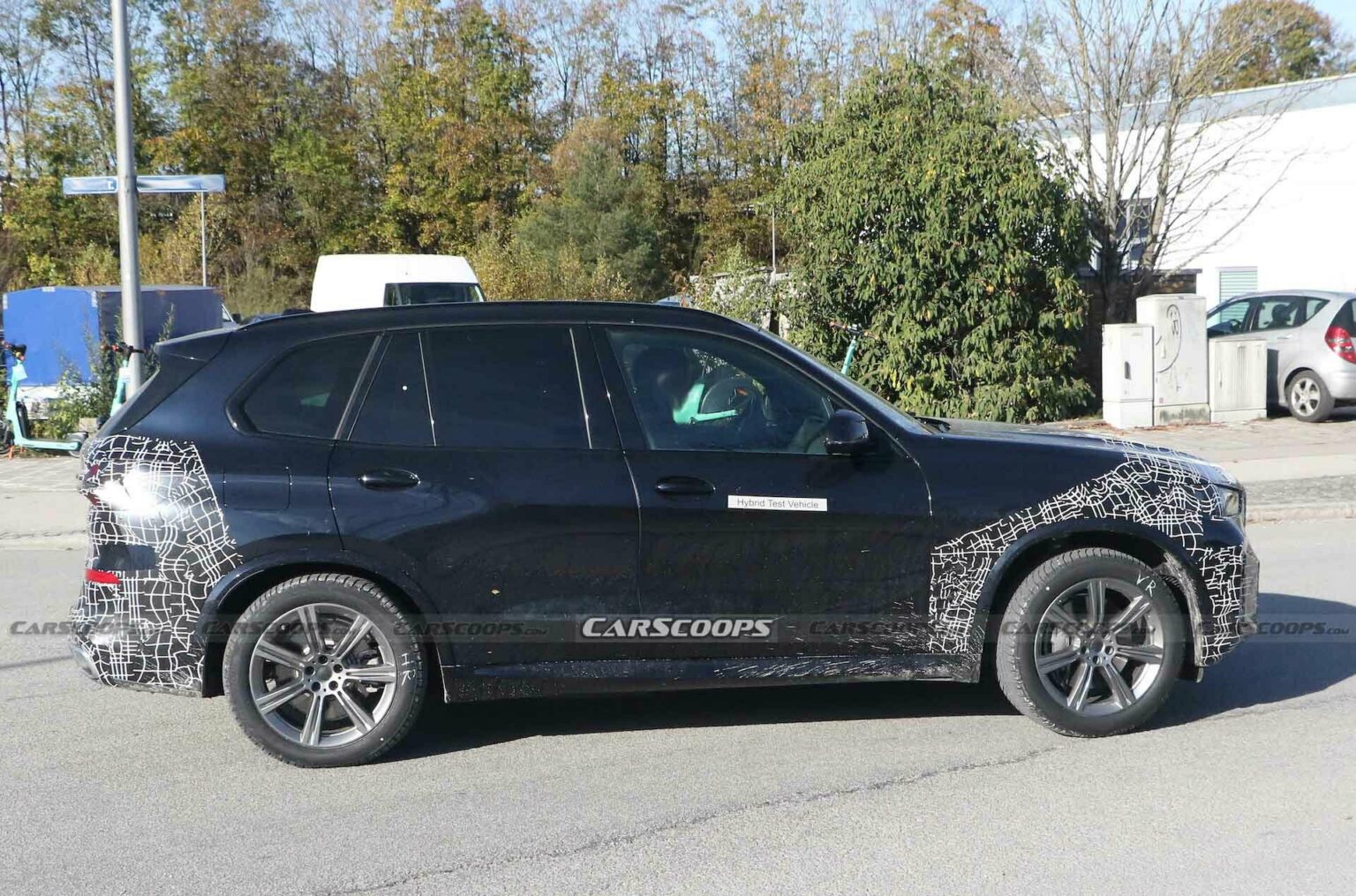 Facelifted 2024 BMW X5 Hybrid Must Be Feeling The Cold, Puts Disguise