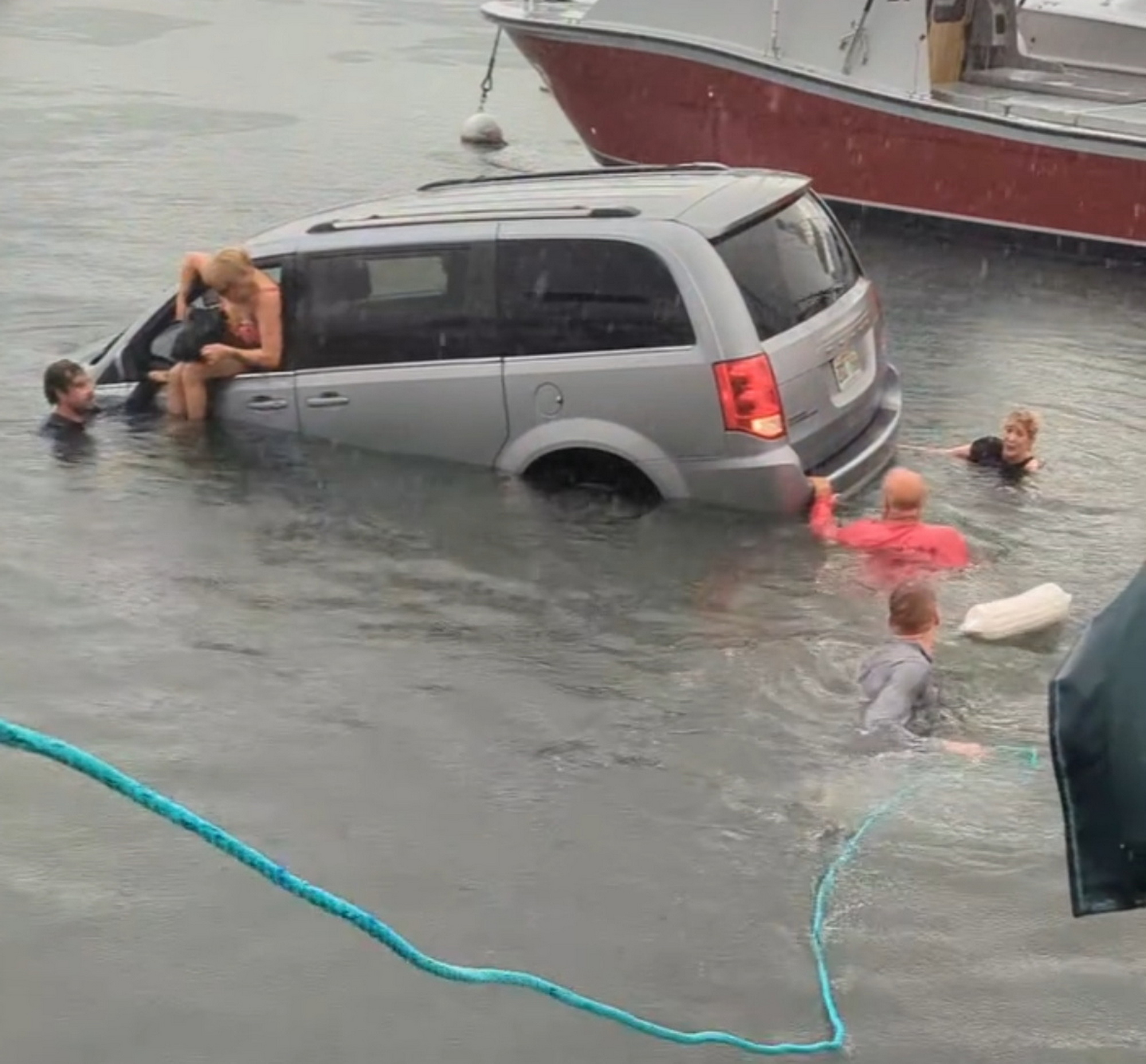 Tourists In Dodge Minivan Follow Their GPS Straight Into The Harbor | Carscoops