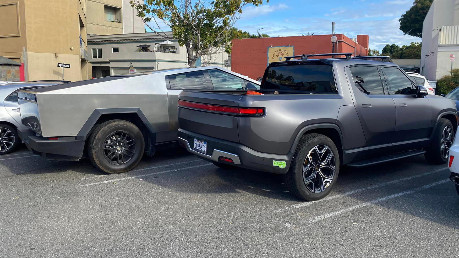 Rivian R1T Lines Up Alongside Tesla Cybertruck Which Would You