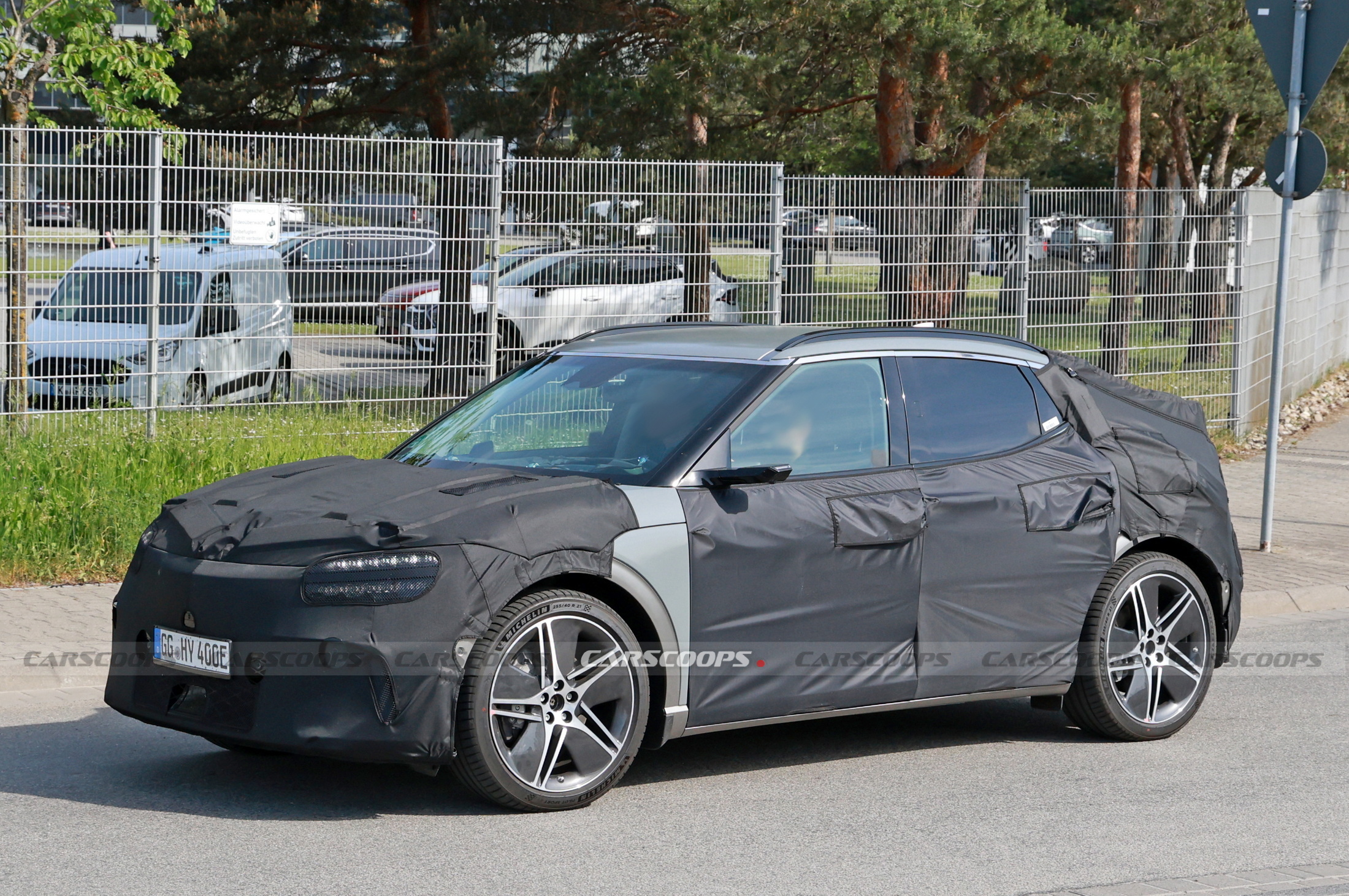 2025 Genesis GV60 Facelift Spied Hiding Its Redesigned Bumpers Carscoops