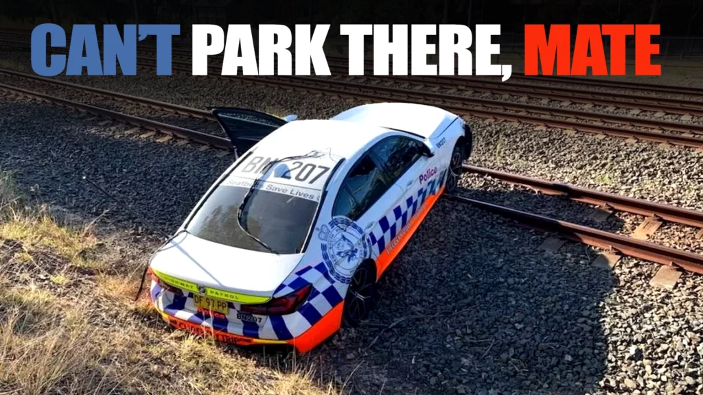  Train Narrowly Misses BMW Police Car Stuck On Tracks After Botched Chase